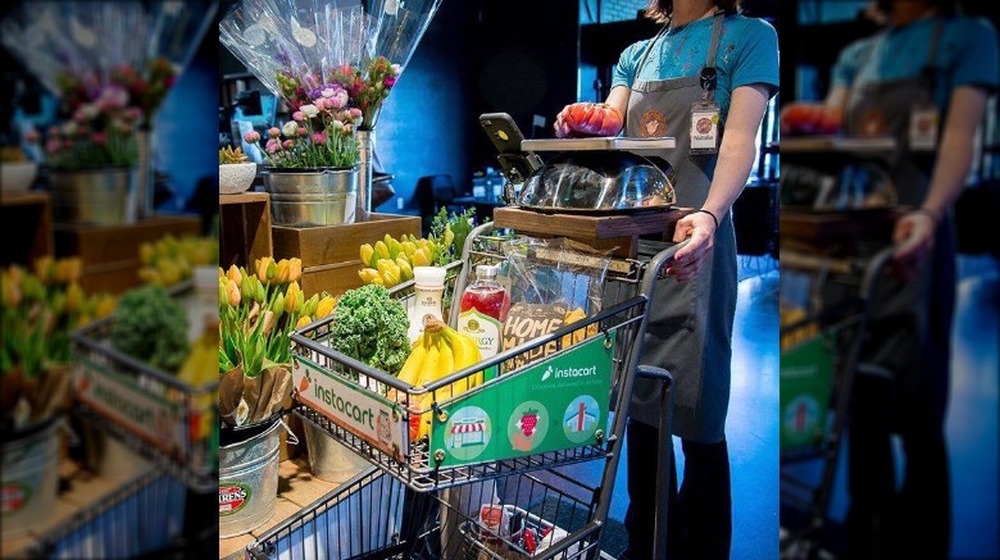 Instacart shopper pushing cart