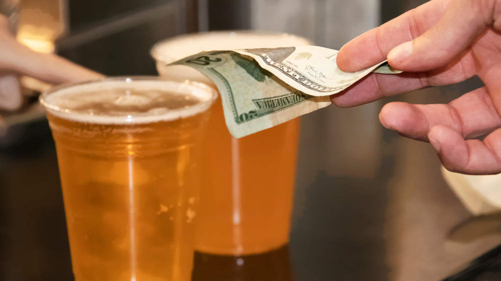 Customer paying for beer