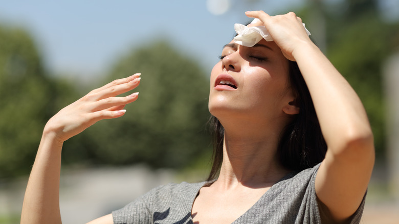 woman sweating on hot day