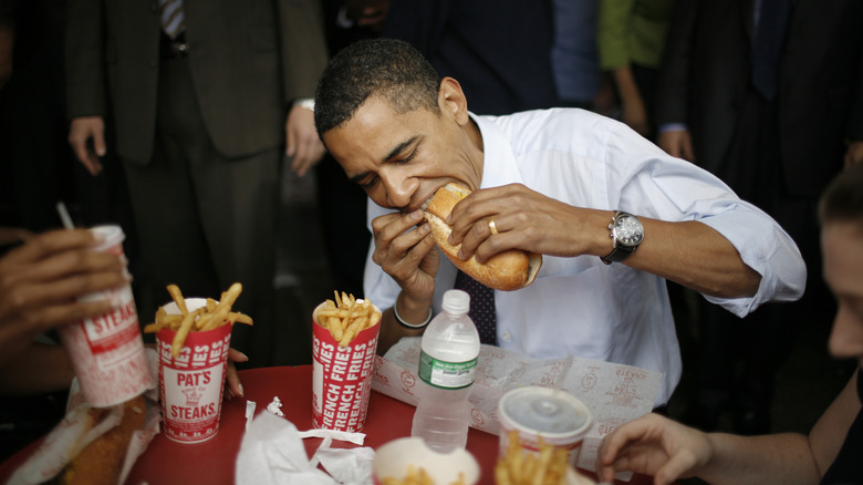 Former President Obama bites into a cheesesteak