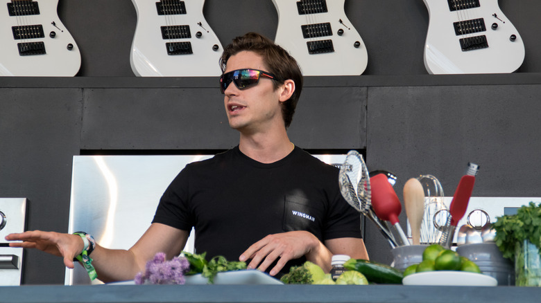 Antoni Porowski talking at outdoor cooking demo