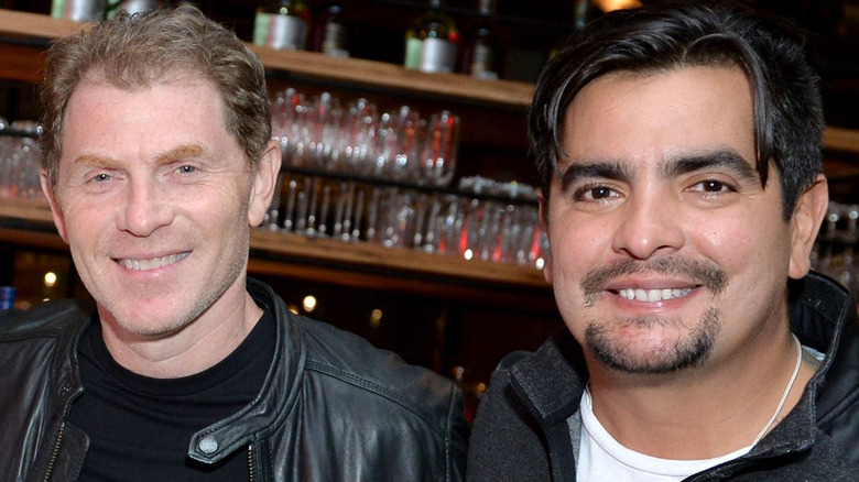 Bobby Flay and Aarón Sánchez smiling