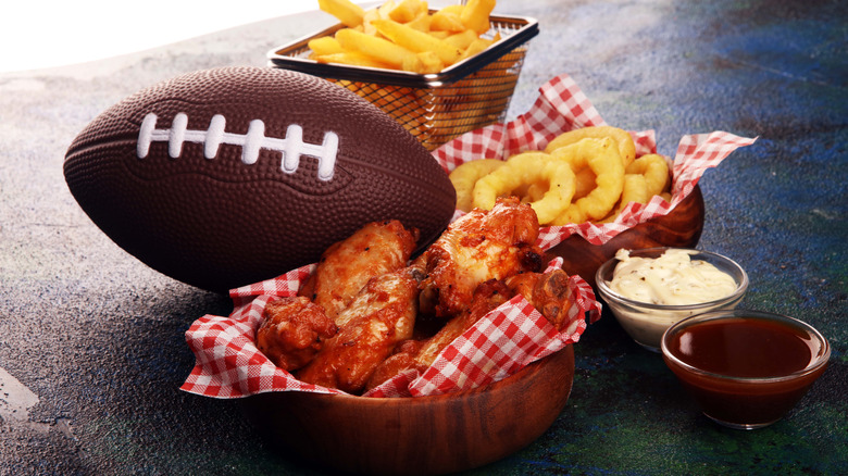 French fires chicken wings onion rings and a football