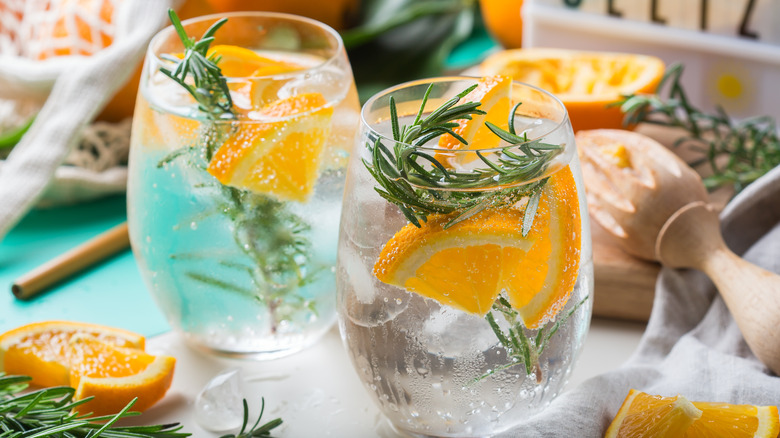 Hard seltzer in glasses with oranges