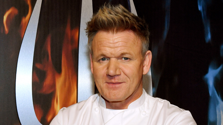 Gordon Ramsay posing against flame background