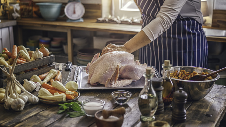 prepping raw turkey for the oven