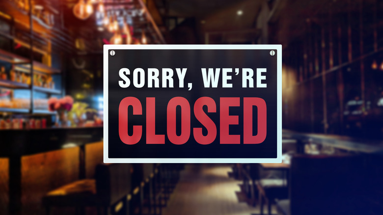 Closed sign on bar