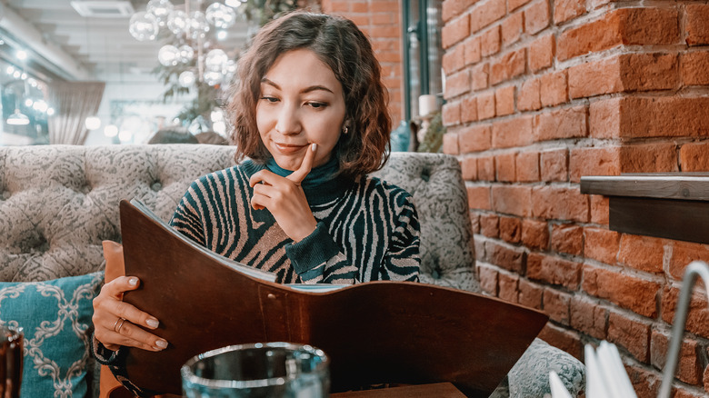 Woman reading menu