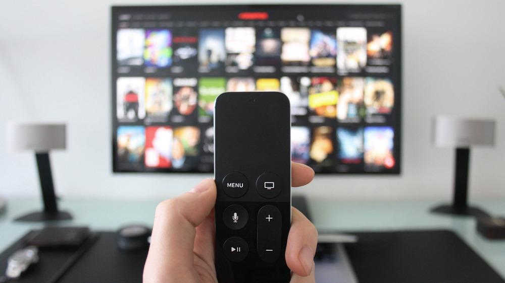 Handing holding remote for TV