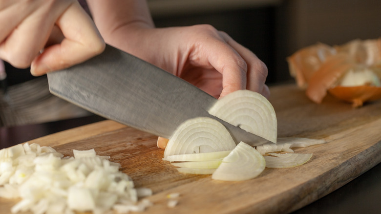 Chopping onion with a knife