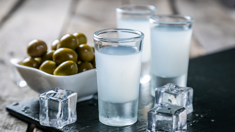 Shots of ouzo and olives 