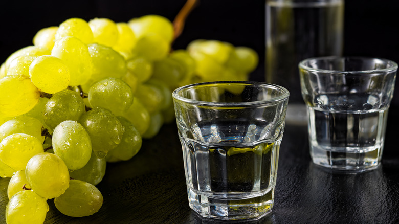 Shots of ouzo and grapes