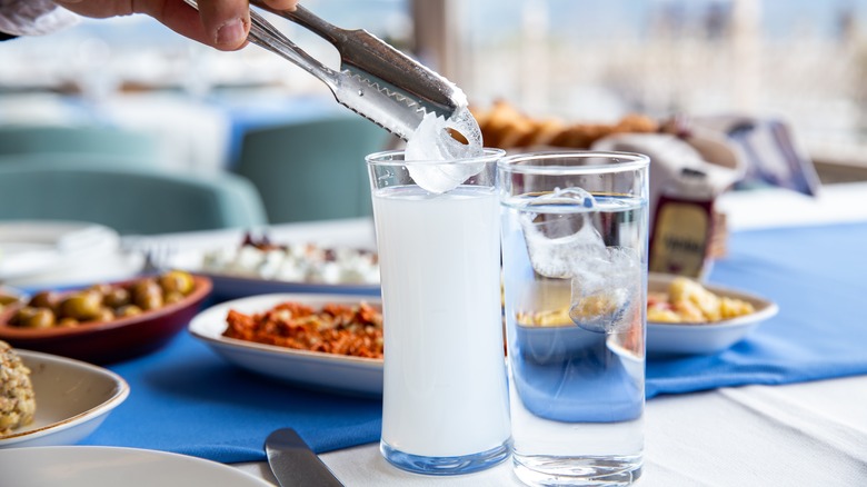 Glass of ouzo with water