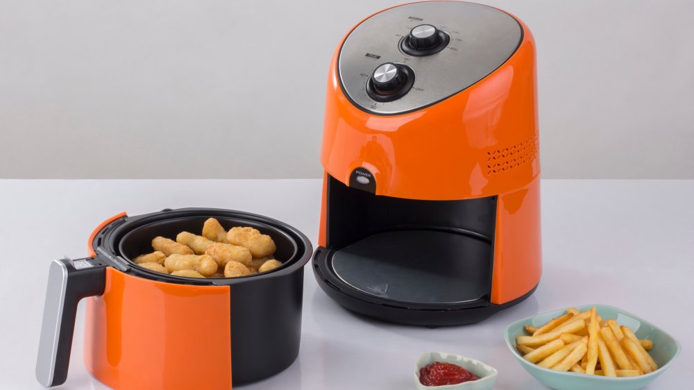 orange air fryer with french fries