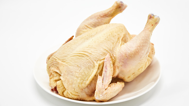 Whole raw chicken with skin