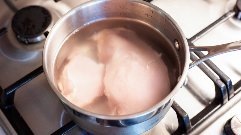 Chicken in pot on stove