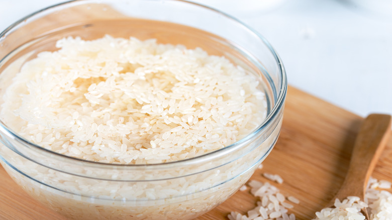 rice soaking in glass bowl