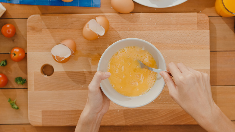 Eggs whisked together in a bowl