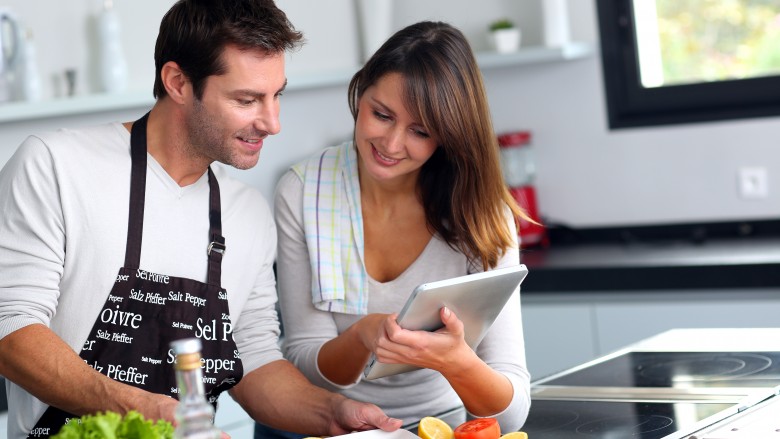 man and woman cooking