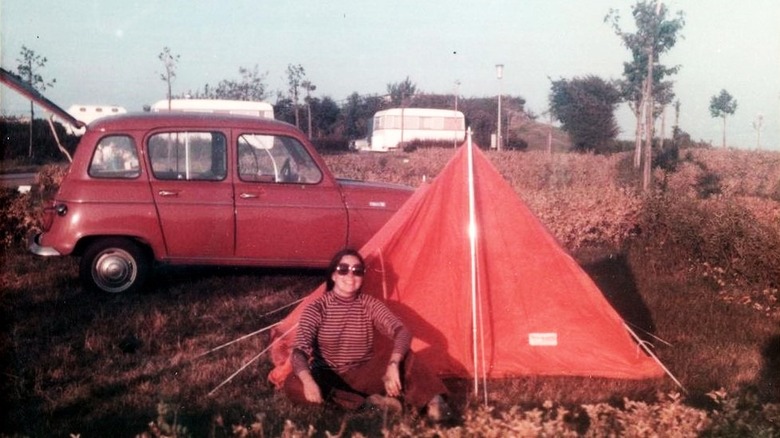 Young Ina Garten sitting by tent