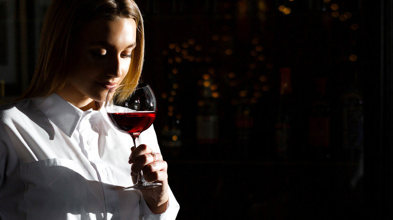 Woman smelling wine 