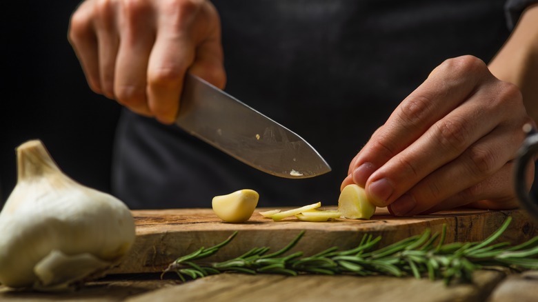 Chef slices vegetables 