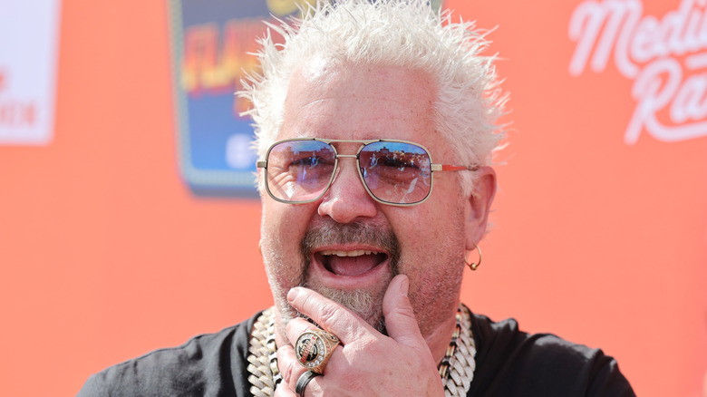 Guy Fieri hwith hand on chin