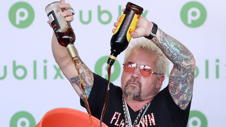 guy fieri pouring bottles