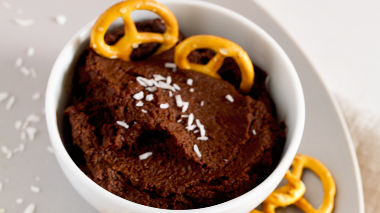 Pretzels in chocolate hummus