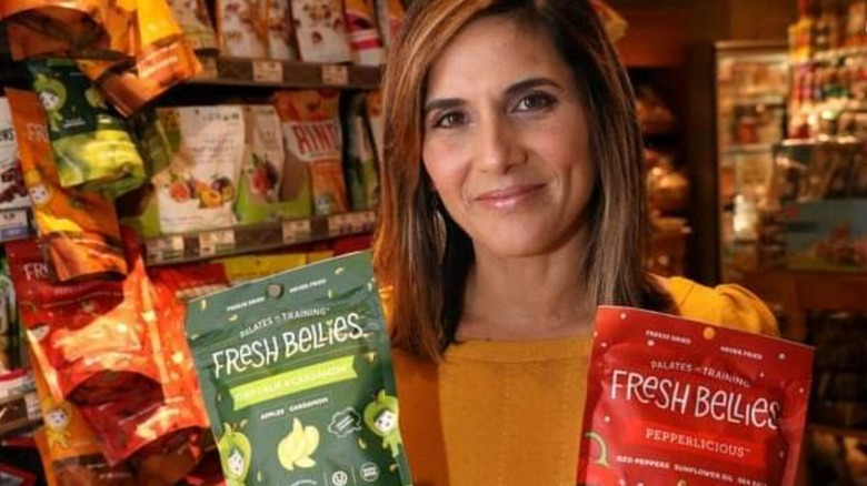 Saskia Sorrosa with bags of Fresh Bellies snacks