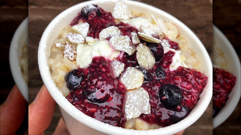 Cup of gourmet oatmeal with berries