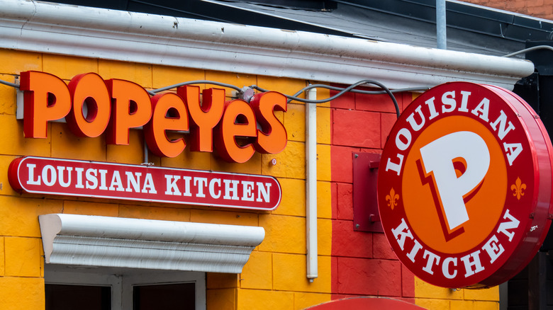 Popeyes orange and red storefront and logo.