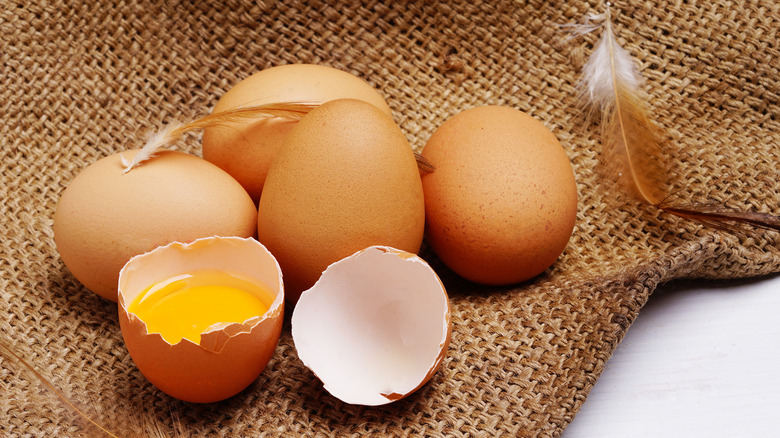 Cracked egg yolk on burlap