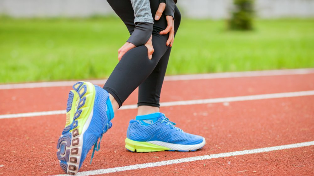 woman having muscle cramp