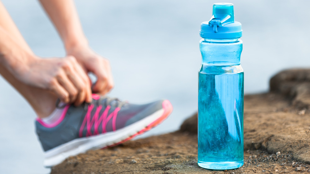 Water bottle with athletic shoe