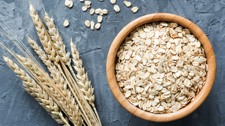 Oats in a bowl next to grain