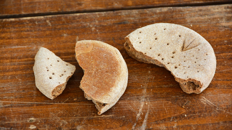 Hard tack biscuit on a wooden background