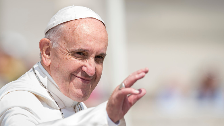 Pope Francis waves to a crowd