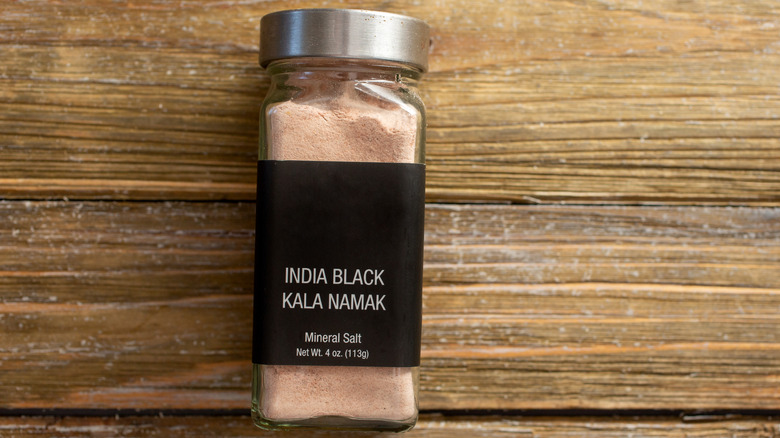 Kala namak or black salt in container