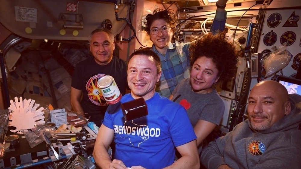 Christina Koch and team with cranberry jelly in space