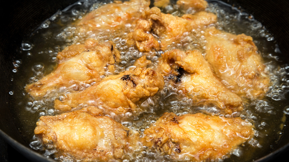 Chicken wings frying in oil