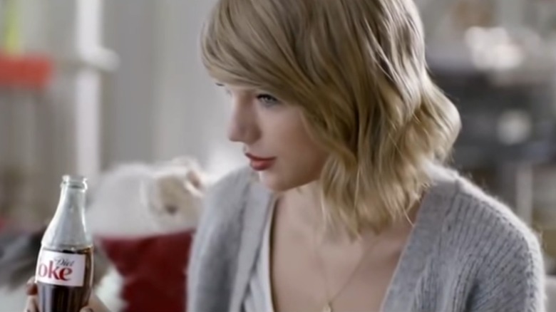 Taylor Swift drinking Diet Coke in commercial