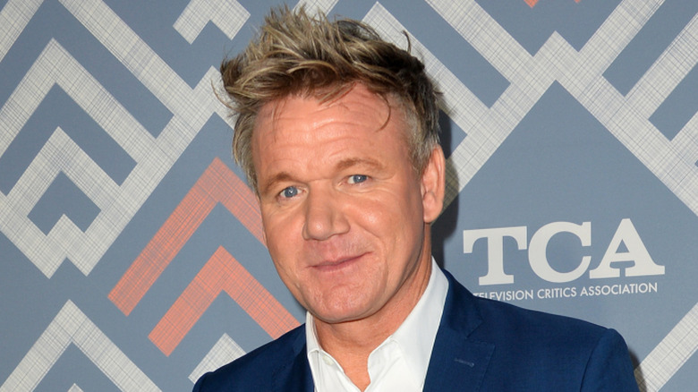 Gordon Ramsay smiling and wearing blue blazer