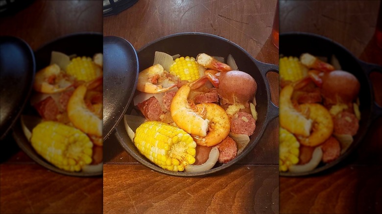 Low country boil in cast iron pot