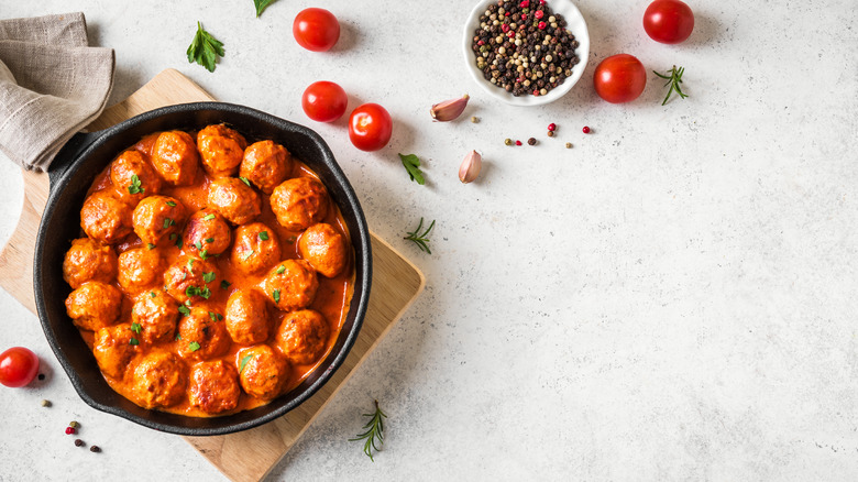 Meatballs in tomato sauce in a cast iron skillet