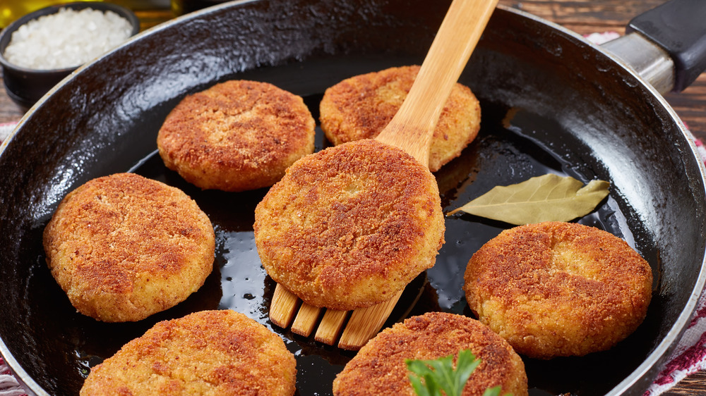 Crispy fried rice cakes in skillet