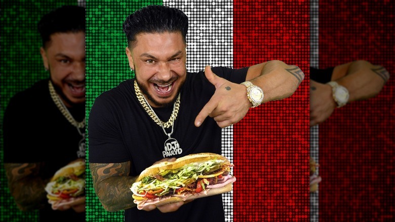 Pauly D holding a sub sandwich