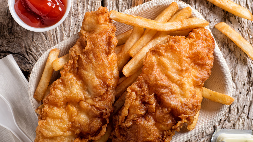 Fried fish with french fries and ketchup