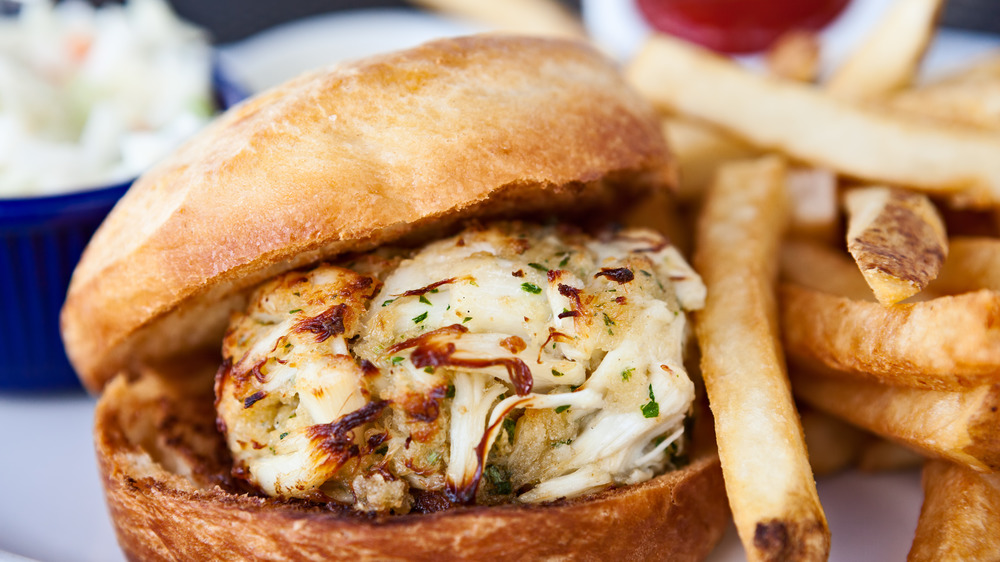 Crab cake sandwich with a side of fries