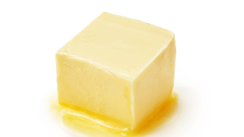 Cube of melted yellow butter